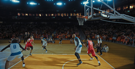 Basketball players on big professional arena during the game. Tense moment of the game. Celebration