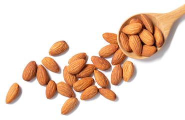 Almond on a spoon and arranged on a white background