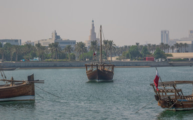 Fototapeta na wymiar Doha, Qatar - located at the Eastern side of the Corniche, the Dhow Harbour is one of the main landmarks of Doha, and show a full display of traditional boats and vessels