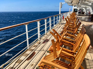 Wooden Deck chairs on luxury and legendary Cunard ocean liner Queen Mary 2 cruise ship QM2 on...