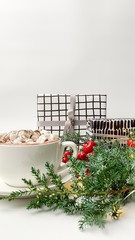 Cacao or cappuchino with marshmallow and fir-tree with presents on white background