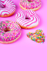 Donuts on a pink background.