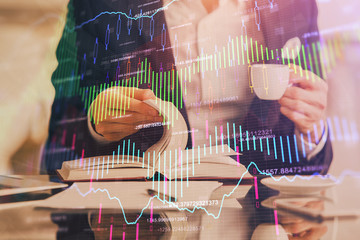 Double exposure of businessman with coffee with stock market forex chart.