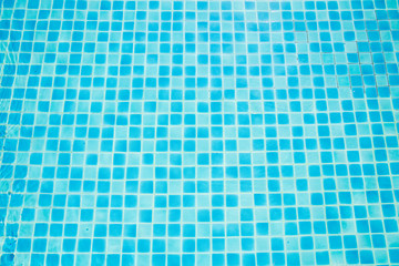 Top view of the color of the blue tiles in the pool. Blue tiles arranged in the free pool at the resort.