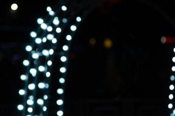 Golden abstract yellow, orange bokeh lights isolated on black background with copy space. Holiday and Christmas season concept, graphic resources, greeting card. wallpaper. Multi-colored lights.