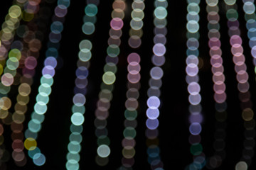 Golden abstract yellow, orange bokeh lights isolated on black background with copy space. Holiday and Christmas season concept, graphic resources, greeting card. wallpaper. Multi-colored lights.