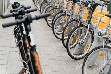 Obraz premium Brussels, Belgium - May 2019: Bicycles for rent are in a special parking lot.