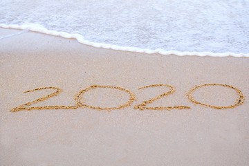 2020 writing in the sand  beach in the morning, appropriate the Backdrop idea copy space