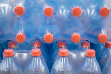 Water in plastic bottles.