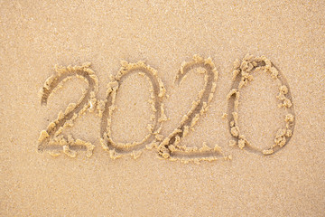 2020 writing in the sand  beach in the morning, appropriate the Backdrop idea copy space