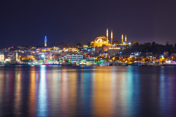 Night view of illuminated Eminonu district with Suleymaniye Camii, Istanbul, Turkey