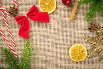 New Year Background Red decorations isolated on linen texture.Xmas celebration pattern.Holiday festive celebration concept.Banner mock up for display of product or design content
