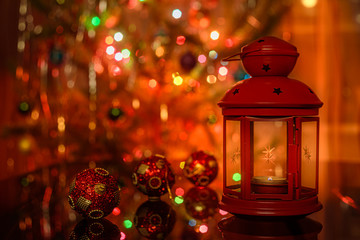 Red lantern and red christmas balls in christmas interior.