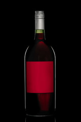Red Wine bottle with empty label isolated on black background