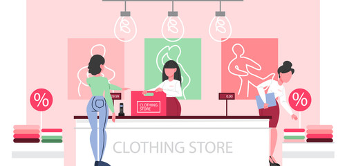 Clothing store interior. Woman standing at the counter in the clothing store