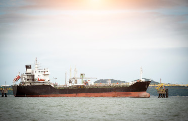 Oil tanker loading crude oil at sea