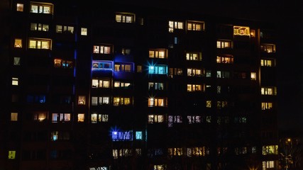 Windows pattern, colored Christmas lights on a dark night background,16:9 panoramic format