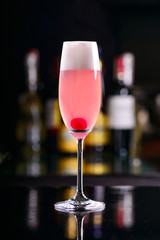 cocktail with pink sparkling wine and egg foam