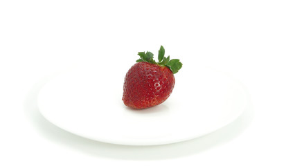 Large, ripe strawberries. Isolated. Juicy dessert, healthy vegetarian food. Bright, colorful breakfast. Strawberries on a white plate, isolated background. Organic, natural food.