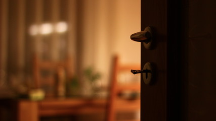 Out of focus of an apartment with table, dish, flowers. Nobody present at home.