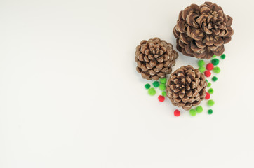 pine cone with decors on a blank surface