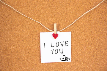 i love you red heart note on the cork board