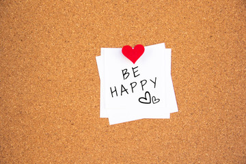 be happy note on cork board