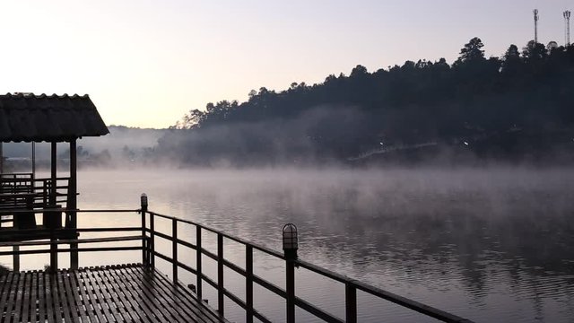 Beautiful landscape morning with mist over lake at Ban Ruk Thai village in Mae Hong Son, Thailand
