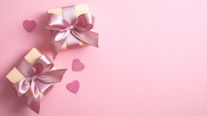 Happy Valentine's Day banner template with two gift boxes and Valentines hearts on pink background...
