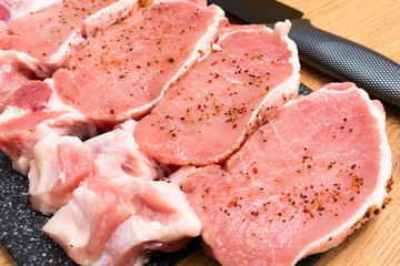 Pieces of different fresh meat on kitchen table