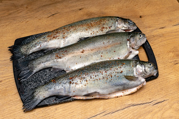 Rainbow trout on a board