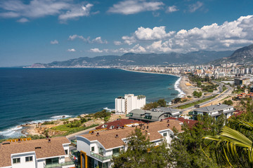 Mahmutlar city near Alanya. View from the mountain to the city, sea, beach and road