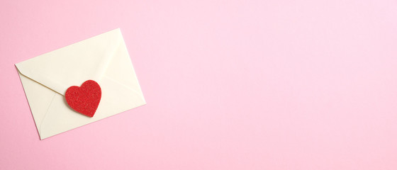 Happy Valentine's Day concept. Wide banner with romantic love letter and red heart on pink...