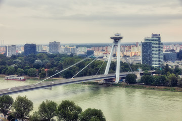 SNP New Bridge through Danude river aerial panoramic view in Bratislava