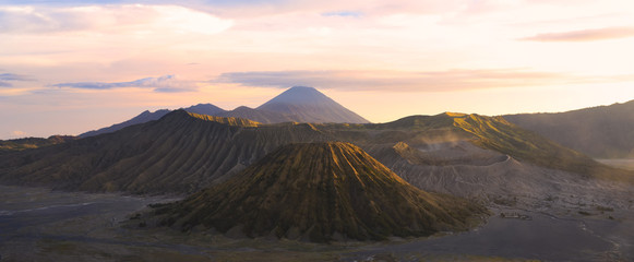 View from above, stunning aerial view of the Mount Batok, Mount Bromo and the Mount Semeru in the...