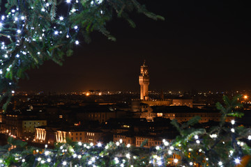 The Palazzo Vecchio in Florence as seen from Piazzale Michelangelo with the lights of Christmas...