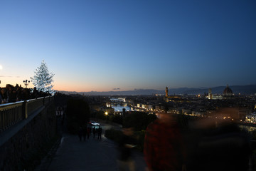 Florence, December 2019: Illuminated Christmas tree at sunset in December at Piazzale Michelangelo...