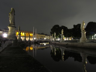 Padova, Italy - October 12th, 2019: Prato della Valle, in Padova, at night. The biggest square in Italy and one of the biggest in Europe, surrounded by a canal of water and by two rings of statues.