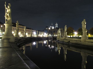 Padova, Italy - October 12th, 2019: Prato della Valle, in Padova, at night. The biggest square in Italy and one of the biggest in Europe, surrounded by a canal of water and by two rings of statues.