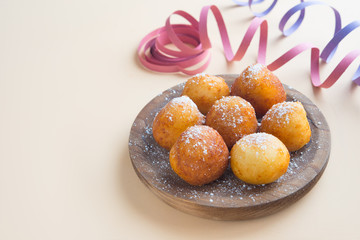 Carnival italian fritters in carnival on brown background