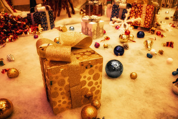 A gift box used to decorate a Christmas scene.