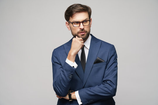 Studuo Shot Of Thinking Businessman Wearing Suit