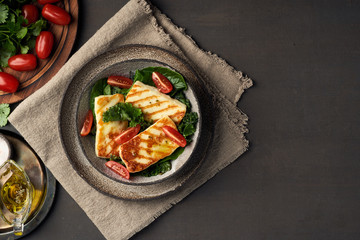 Cyprus fried halloumi cheese with healthy green salad. Lchf, pegan, fodmap, paleo, scd, keto diet.