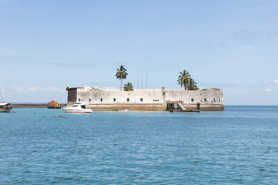 View of Sao Marcelo Fort, boats, blue sea and clear sky, Salvador, Brazil