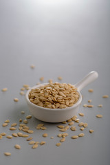 Dry watermelon seeds in a white cup