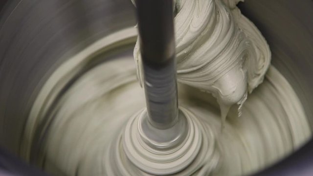 Close up on a mixing ice cream machine operating