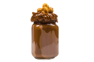 Chocolate milkshake with whipped cream, cookies, waffles, served in glass mason jar. 