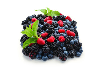 Blackberry, raspberry, blueberry and mint background.