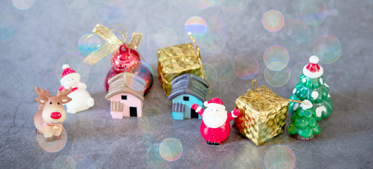 Christmas holiday compositions on dark gray or cement floor background with bokeh snow