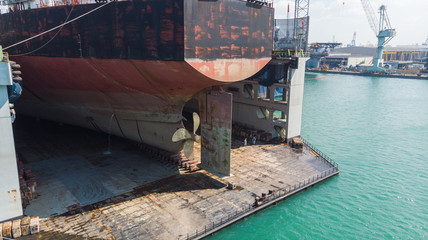 ship stern with propeller at drydock for maintenance follow anual plan and service